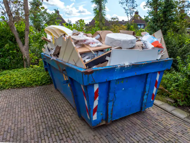 Blue Loaded garbage dumpster
